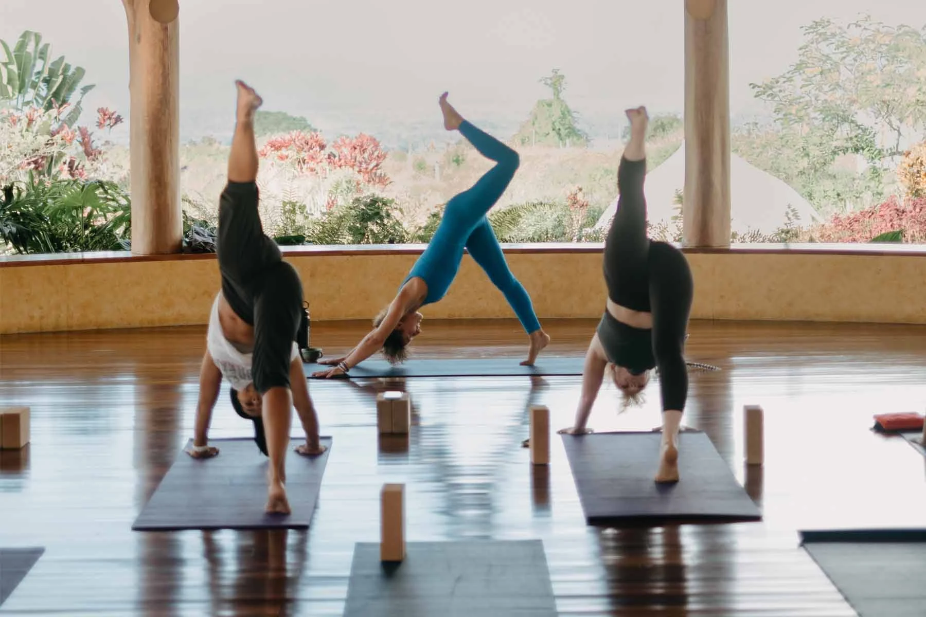 Morning yoga movement and breathwork practice on the open-air teak pavilion overlooking Mt. Chirripó